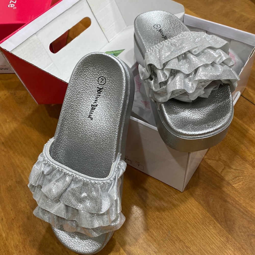 NWT.  Woman’s size 7 slide sandal.